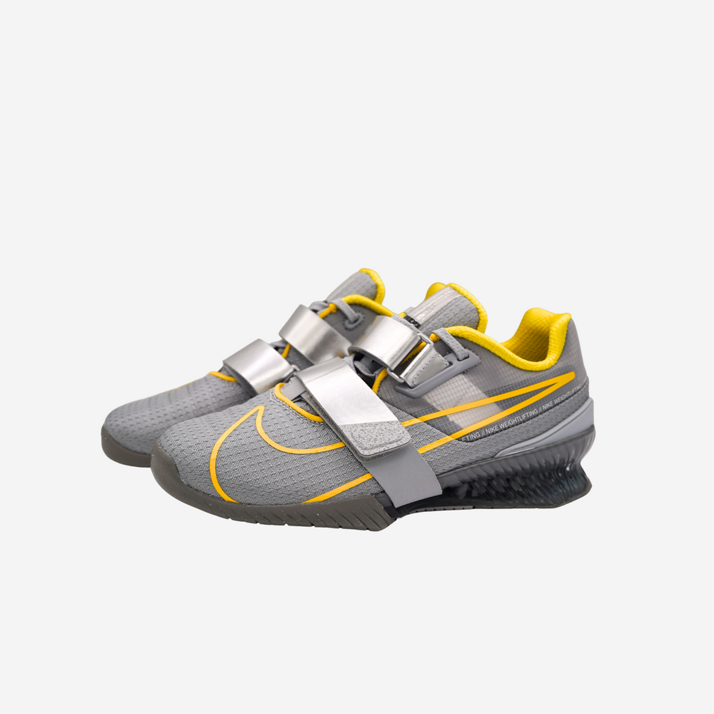 pair of Nike Romaleoss 4 in grey and yellow 