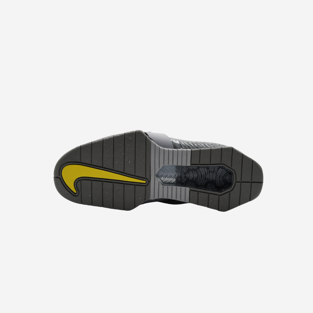 sole of Nike Romaleos 4 in grey with yellow Nike logo 