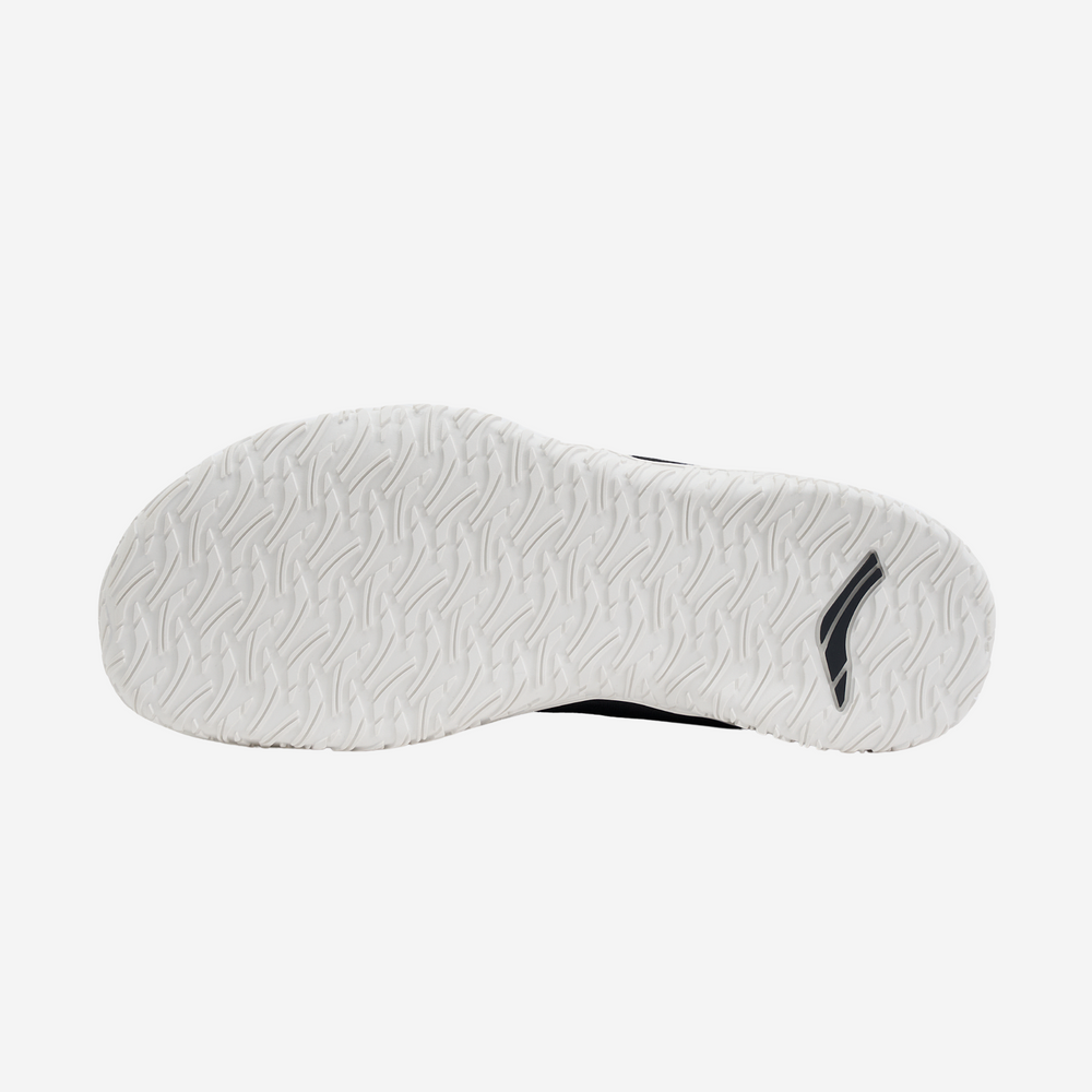 Close-up of a white shoe sole with a brand logo on a white background