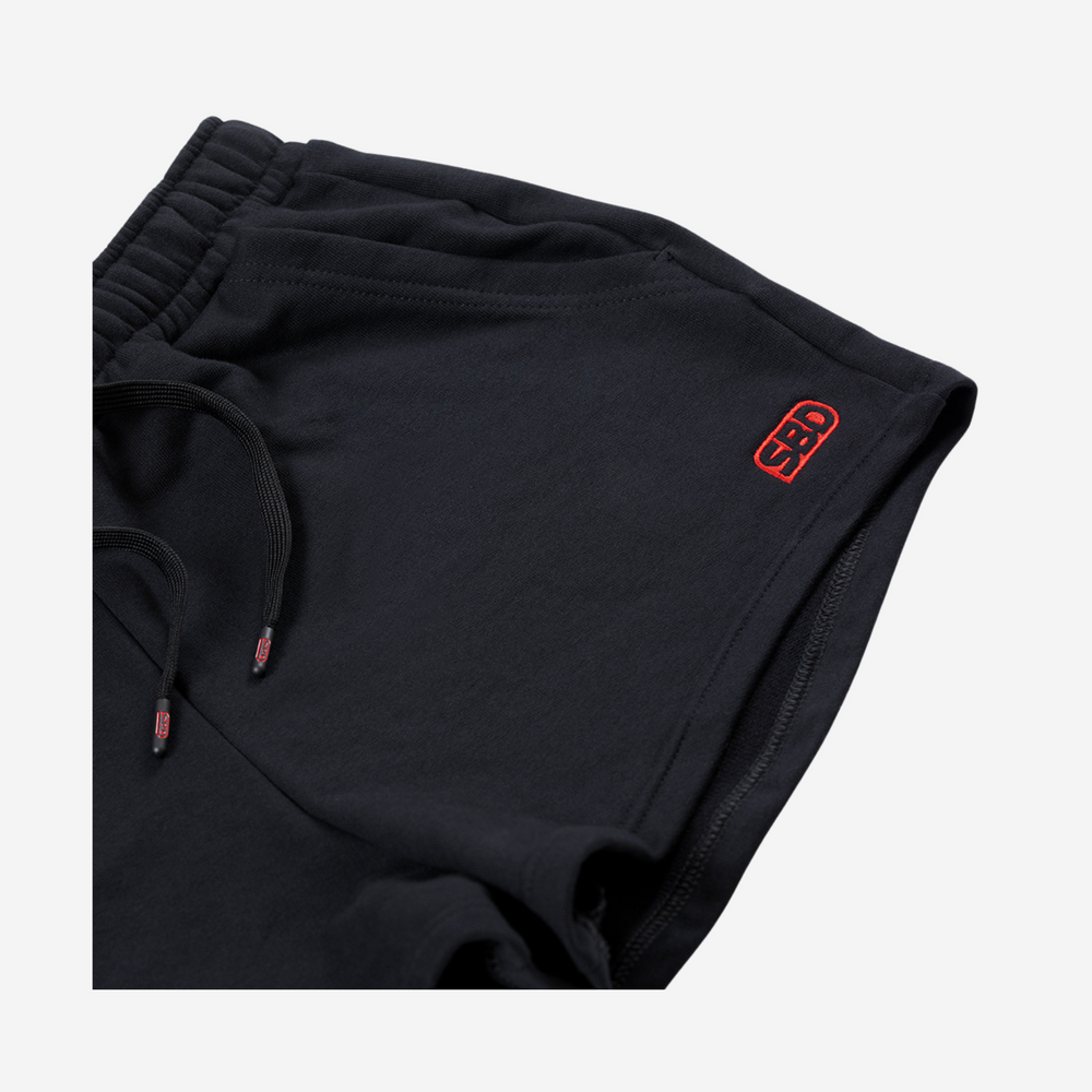 SBD women's shorts in black with SBD logo and branded draw cords cap-ends 