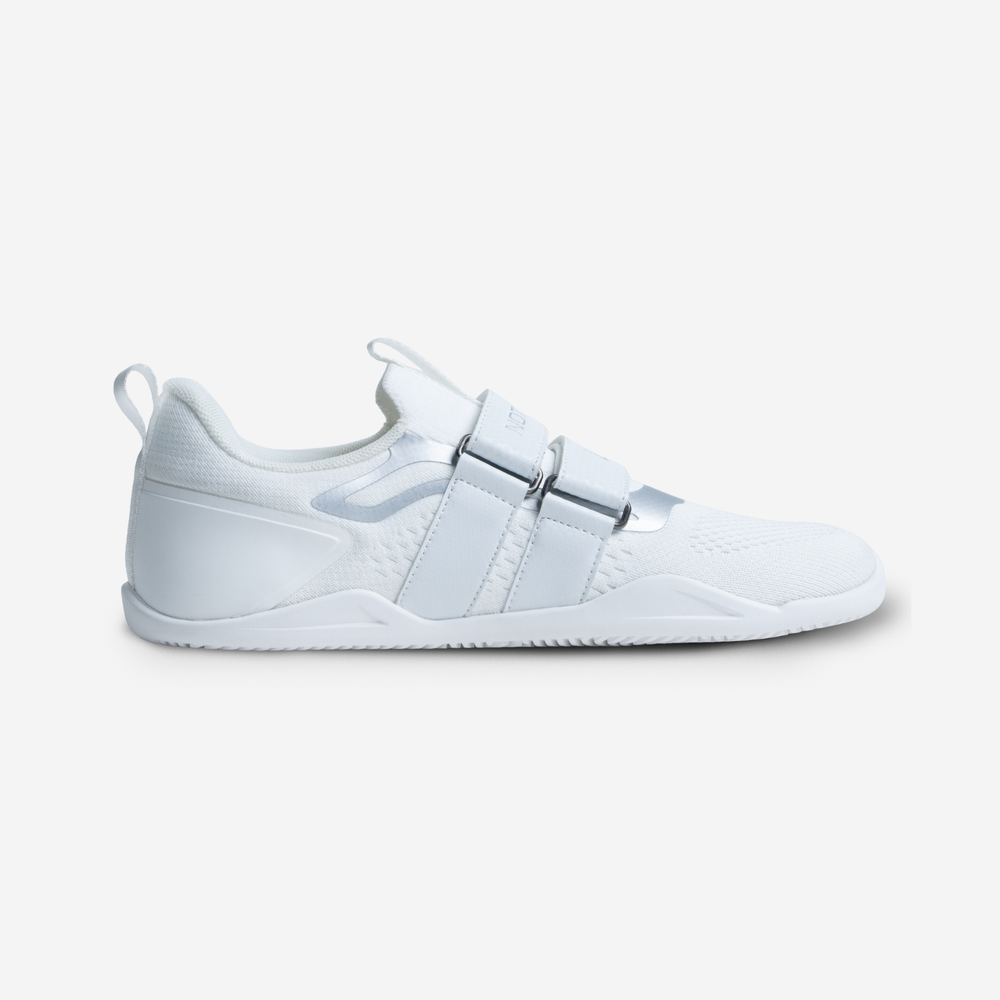 White sneaker with a strap design on a light gray background